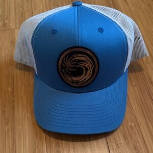 NWT surf trucker hat with wood carving emblem